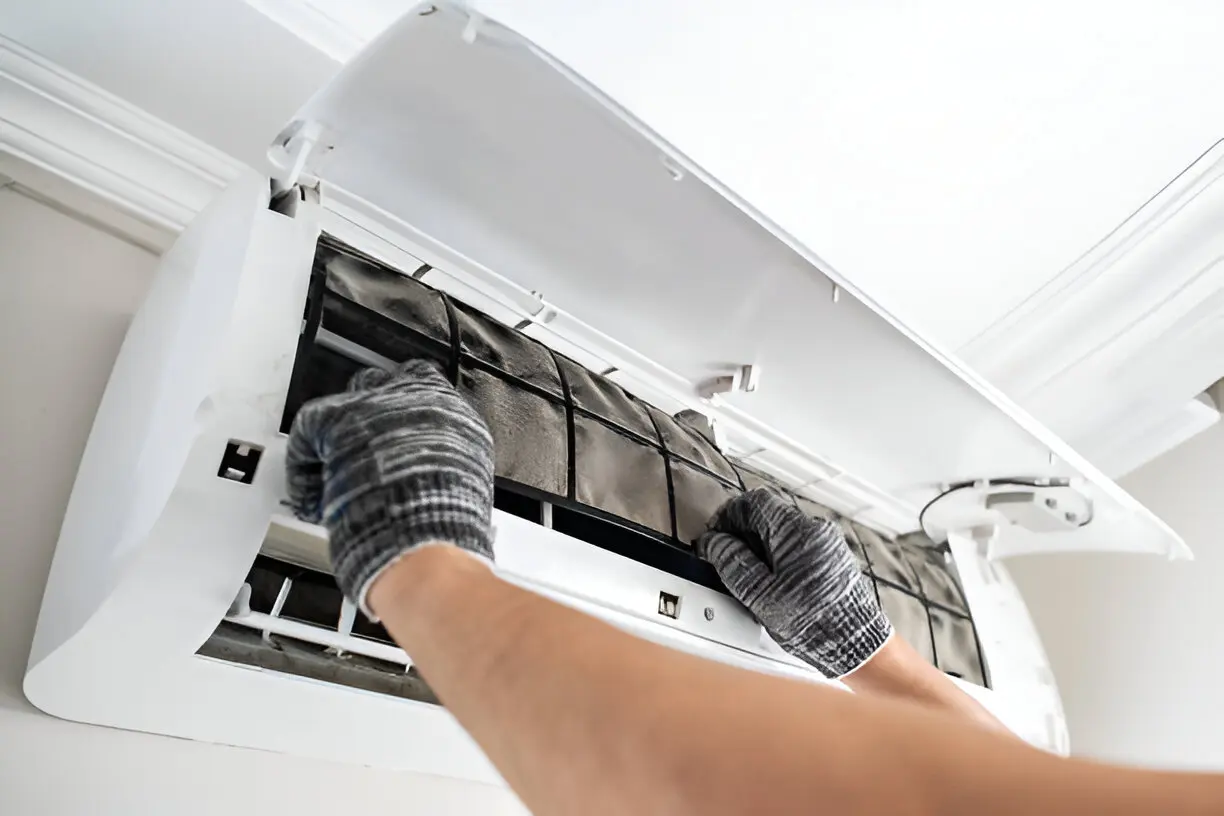 Certified HVAC technician performing air conditioning service on a residential AC unit in Los Angeles
